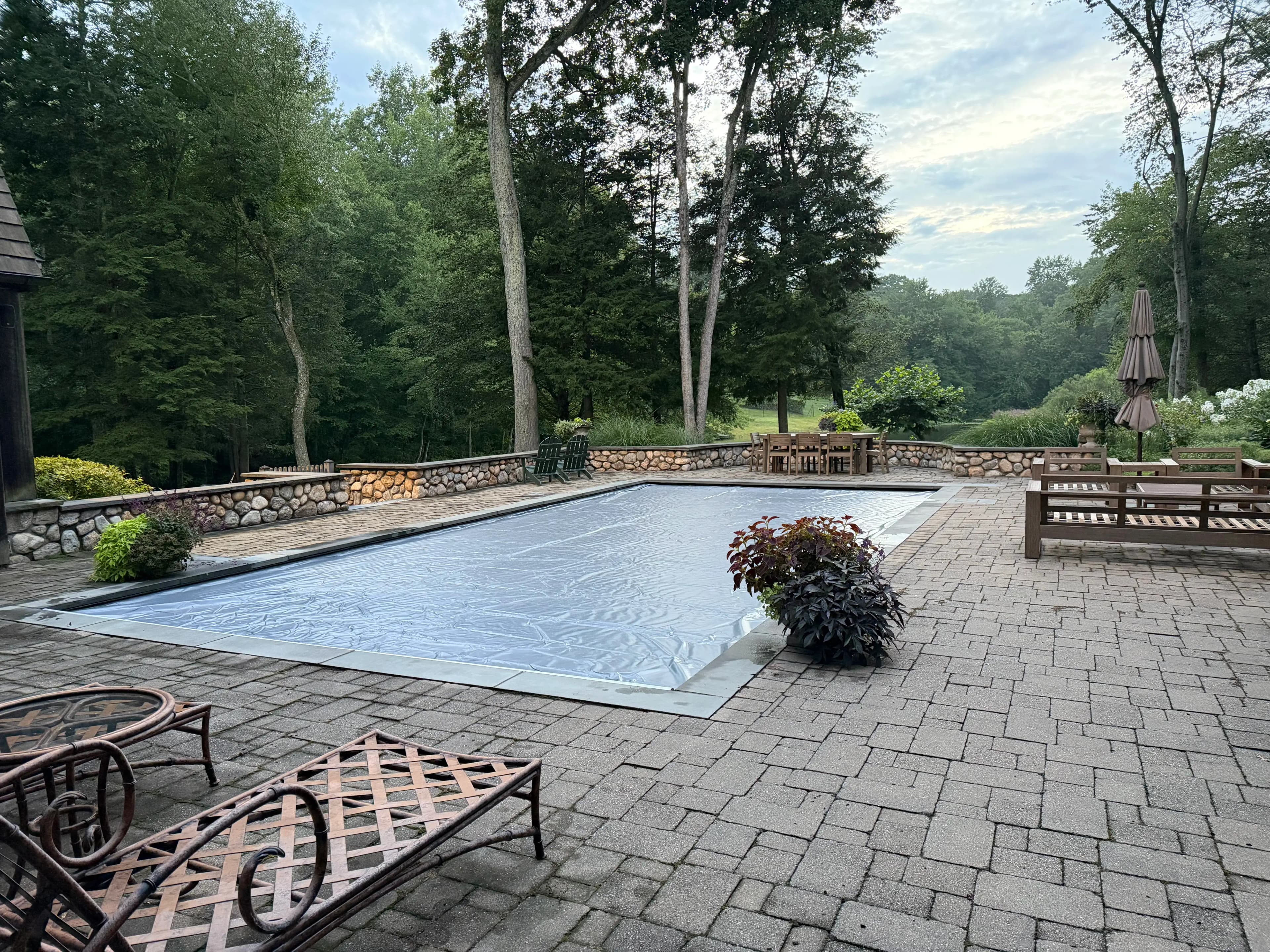 Automatic safety cover extended across a pool at a Westchester County home
